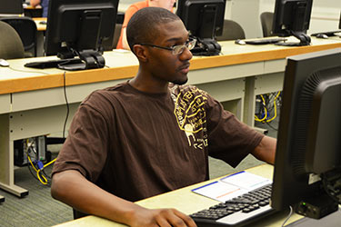 photo of a student in a computer lab