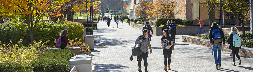 photo of students walking outside on campus