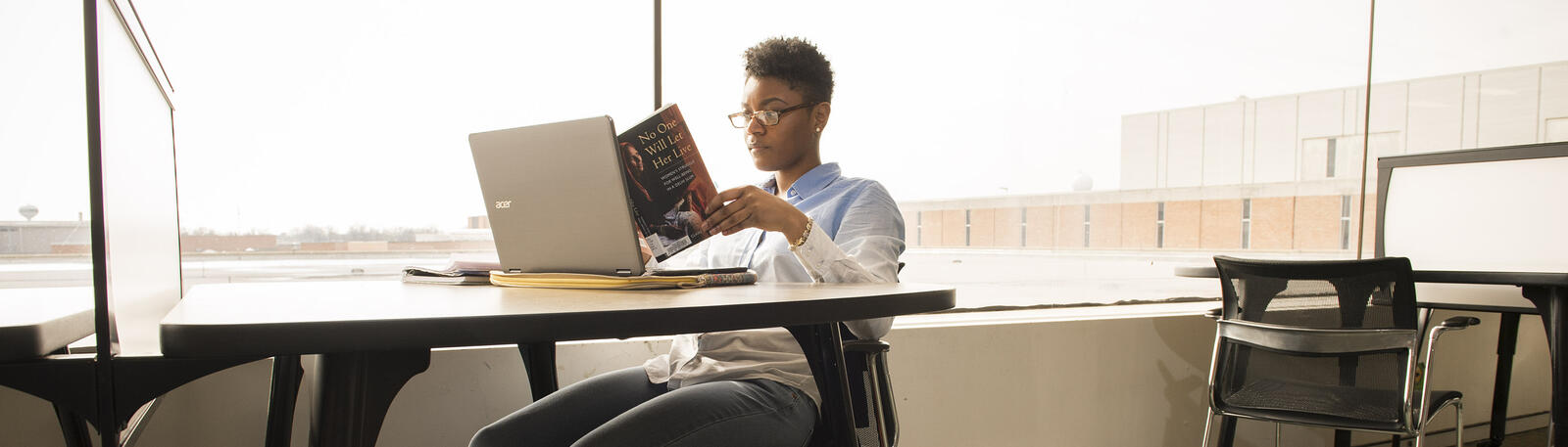 photo of a student studying in the library
