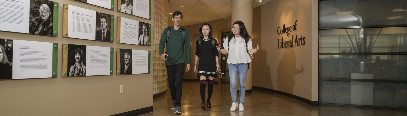 photo of students walking in a building on campus
