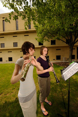 photo of two musicians playing their instruments outside on wright state's campus