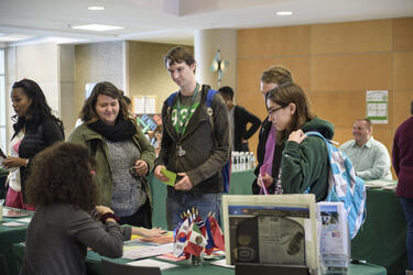 photo of faculty and students at a fair